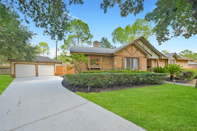 view of front of house featuring a garage and a front lawn