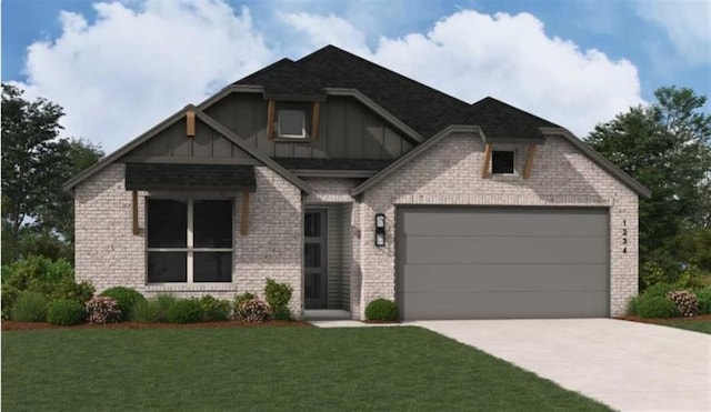 view of front of home featuring a garage and a front lawn