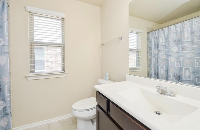 bathroom featuring tile patterned floors, toilet, and vanity