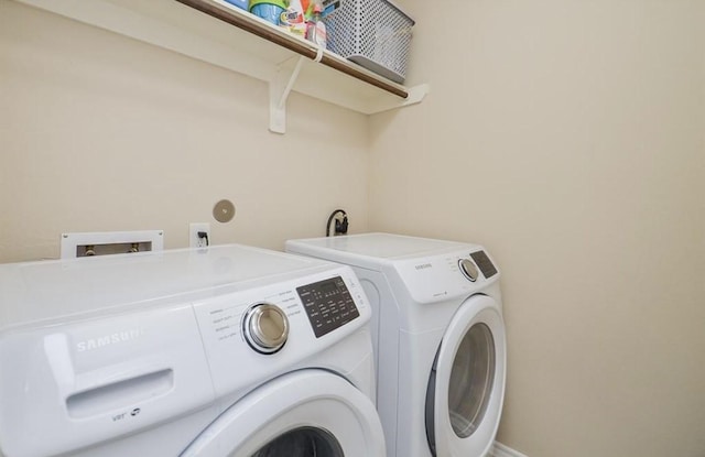 laundry area with separate washer and dryer