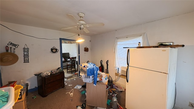 interior space featuring ceiling fan and white fridge