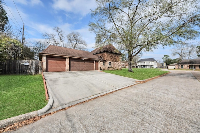 view of front facade with a garage and a front lawn