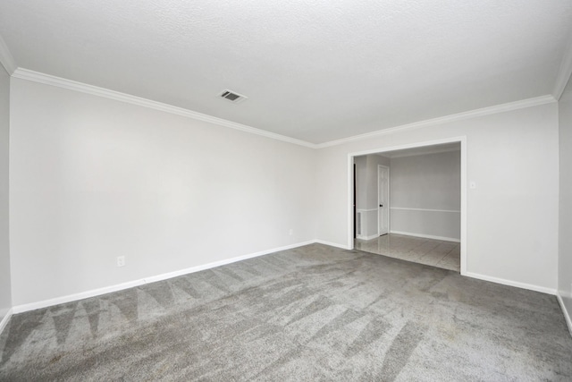 unfurnished bedroom with ornamental molding, carpet, and a textured ceiling