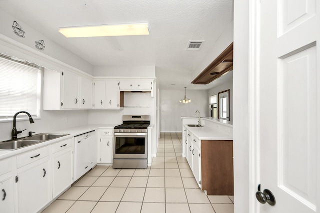 kitchen with stainless steel gas stove, sink, white cabinetry, and dishwasher