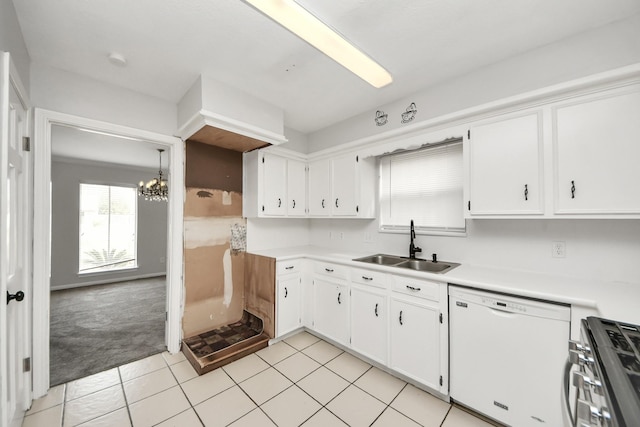 kitchen with sink, stainless steel gas range, white cabinetry, white dishwasher, and light colored carpet