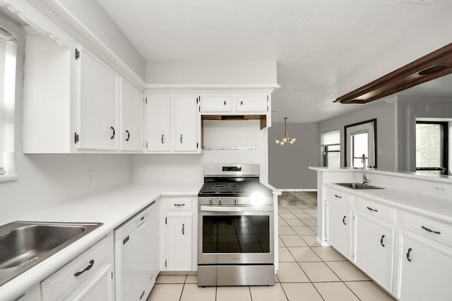 kitchen with white cabinetry, dishwasher, sink, and stainless steel range oven