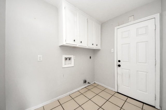 laundry room with cabinets, hookup for an electric dryer, hookup for a washing machine, and light tile patterned floors