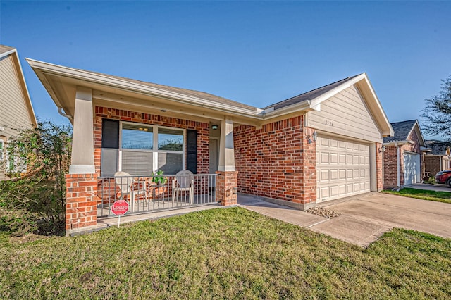 ranch-style home featuring a porch, a garage, and a front yard