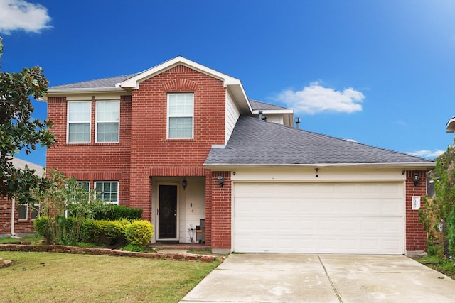 view of front of house featuring a garage and a front lawn