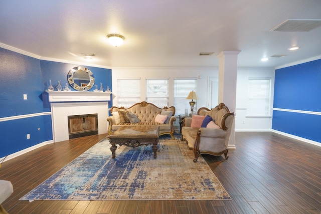 living room featuring crown molding, decorative columns, and dark hardwood / wood-style floors