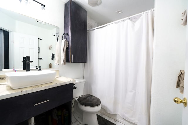 full bathroom with vanity, toilet, and shower / tub combo with curtain