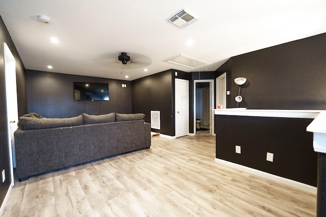 home theater room featuring light wood-type flooring