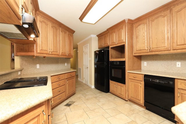 kitchen featuring backsplash, crown molding, and black appliances