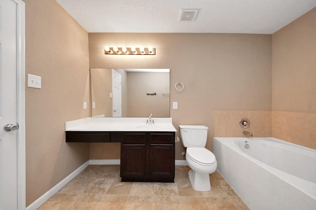 bathroom with vanity, toilet, and a bathing tub