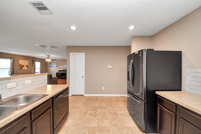 kitchen with dark brown cabinetry, stainless steel fridge with ice dispenser, tasteful backsplash, and dishwasher