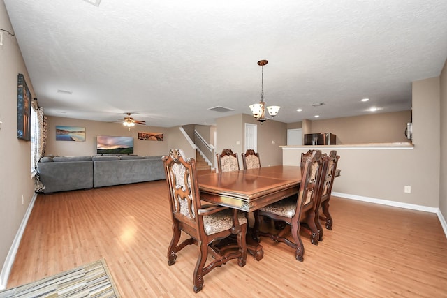 dining area featuring ceiling fan, a textured ceiling, and light wood-type flooring