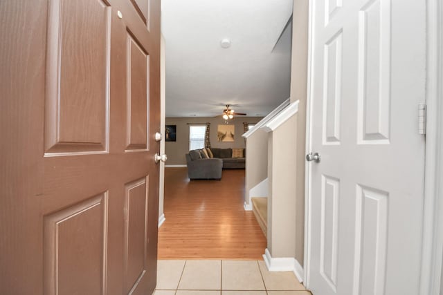 hallway with light tile patterned floors