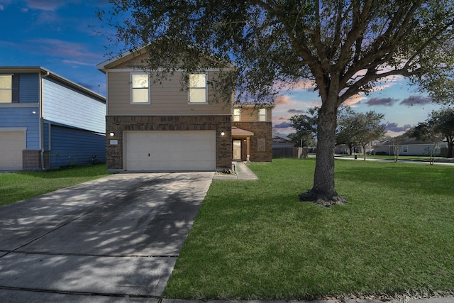 view of property featuring a garage and a yard