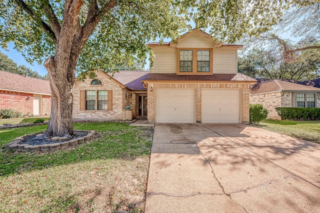 view of front property featuring a garage and a front yard