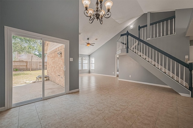 unfurnished living room featuring light tile patterned floors, ceiling fan with notable chandelier, and high vaulted ceiling