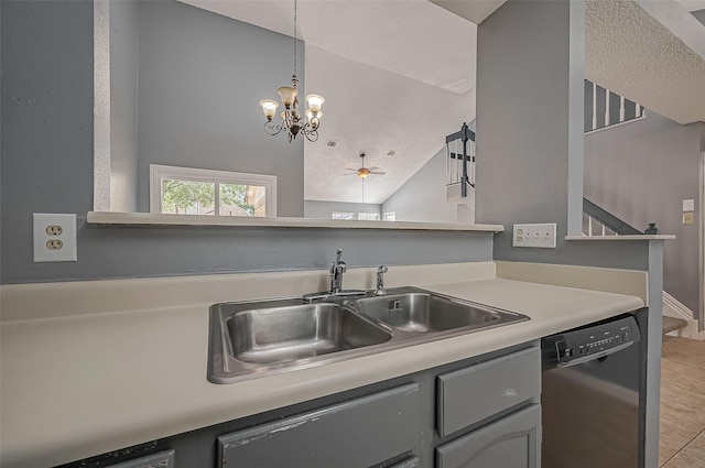 kitchen with pendant lighting, sink, light tile patterned floors, lofted ceiling, and dishwasher