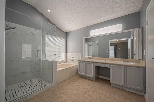 bathroom featuring vaulted ceiling, shower with separate bathtub, vanity, and a textured ceiling