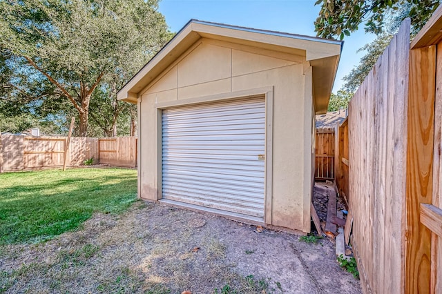 garage featuring a yard