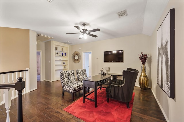 living room featuring dark wood-type flooring, ceiling fan, and built in features