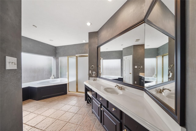 bathroom featuring vanity and shower with separate bathtub