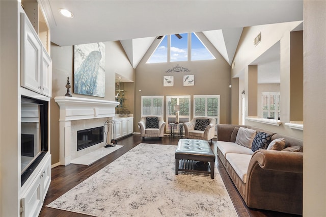 living room featuring dark hardwood / wood-style floors and high vaulted ceiling