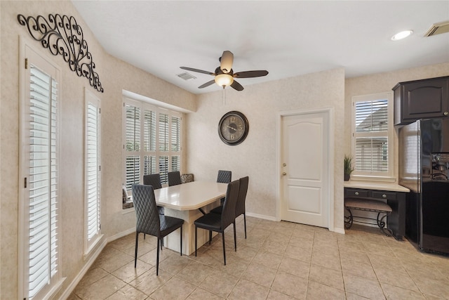 dining area with ceiling fan, a healthy amount of sunlight, and light tile patterned floors