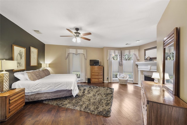 bedroom featuring dark wood-type flooring and ceiling fan