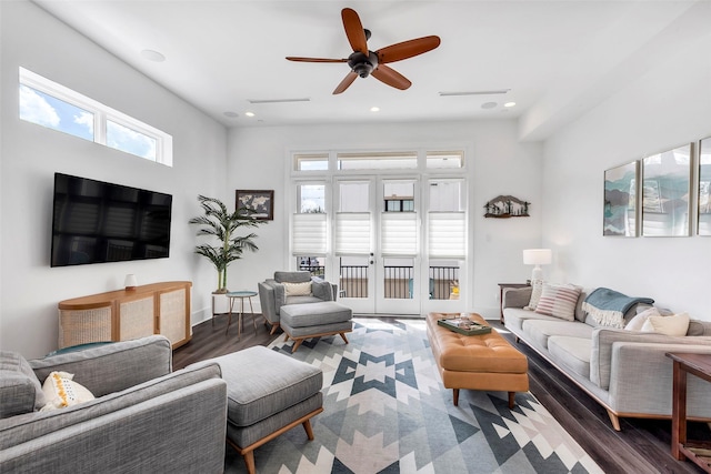 living room with dark hardwood / wood-style floors and ceiling fan