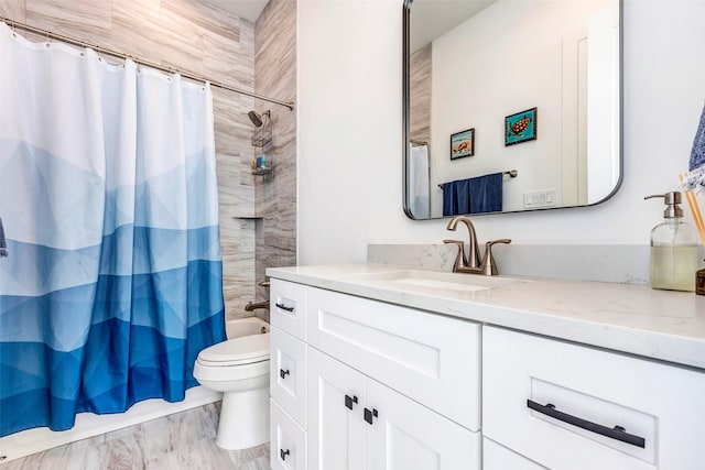 full bathroom featuring shower / tub combo with curtain, vanity, and toilet