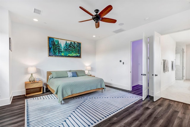 bedroom with dark hardwood / wood-style floors and ceiling fan