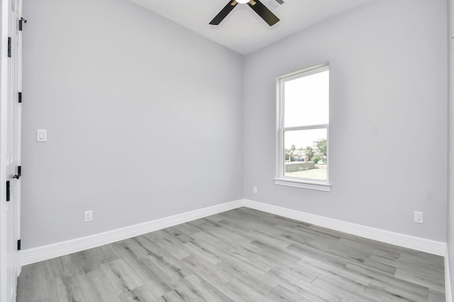 empty room featuring ceiling fan and light wood-type flooring