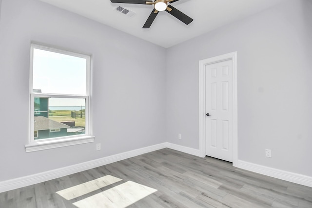 unfurnished room featuring ceiling fan and light hardwood / wood-style flooring