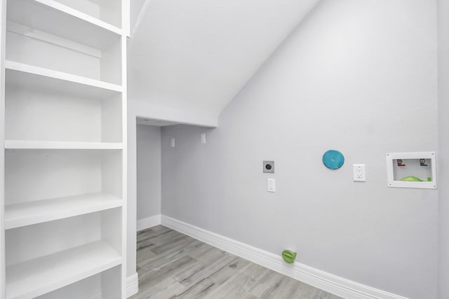 laundry room featuring washer hookup, light hardwood / wood-style flooring, and hookup for an electric dryer