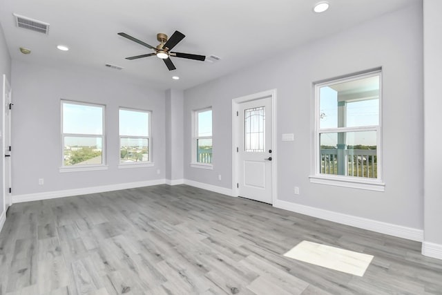 interior space with ceiling fan and light hardwood / wood-style floors