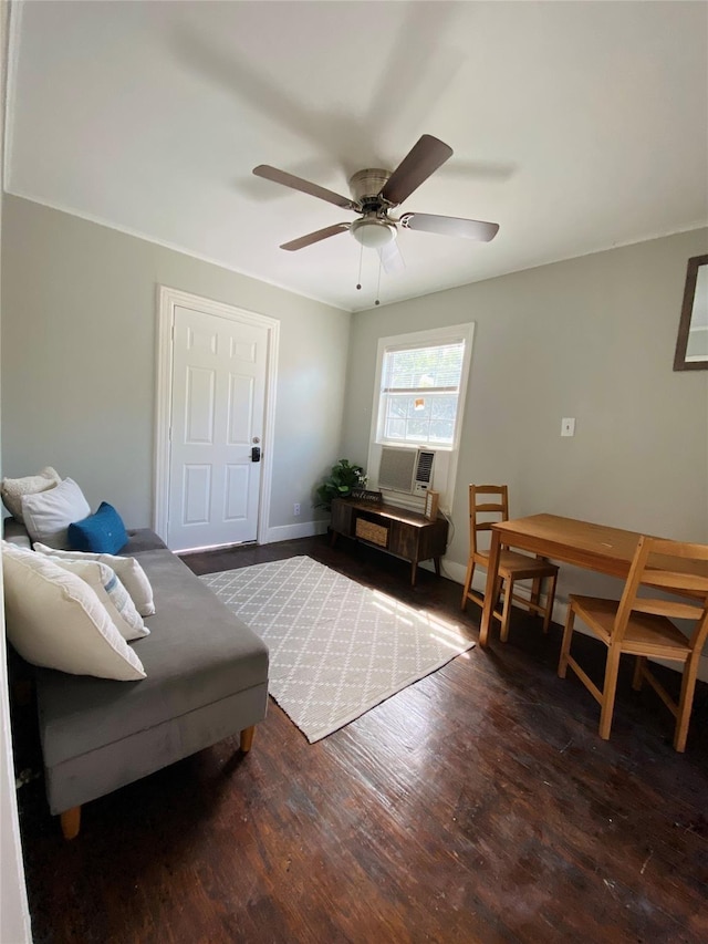 living room with dark wood-type flooring and ceiling fan