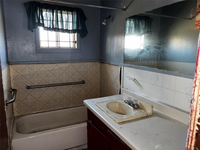 bathroom featuring vanity and tile walls