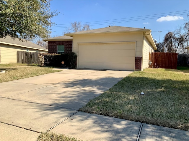 single story home featuring a garage and a front lawn