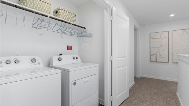 laundry area with carpet flooring and washer and clothes dryer