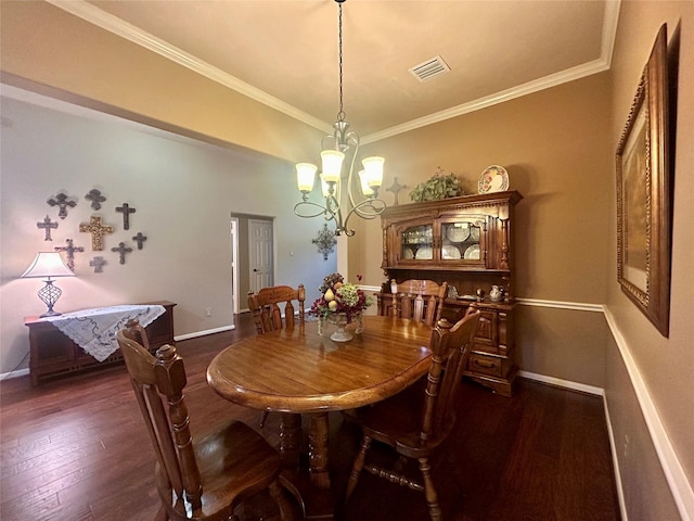 dining space with baseboards, crown molding, dark wood-style flooring, and a notable chandelier