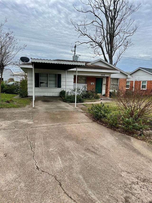 ranch-style house with a carport