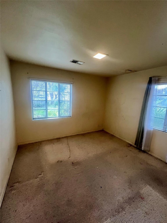 empty room featuring carpet flooring