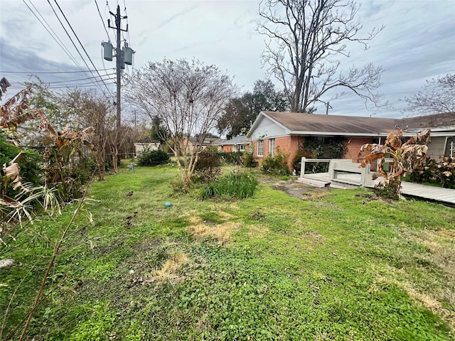 view of yard with a deck