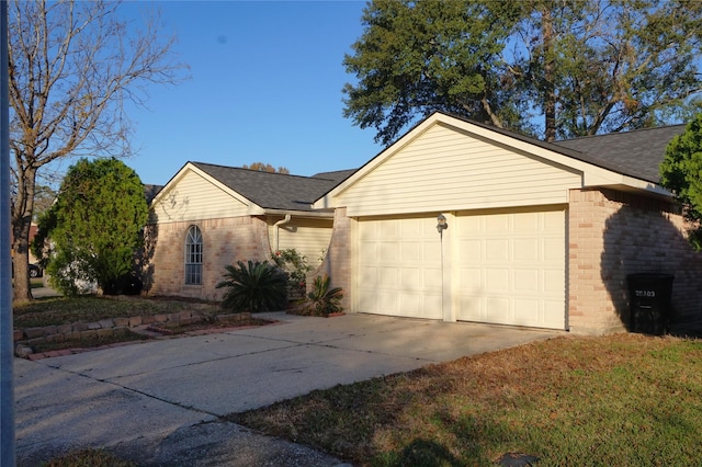 ranch-style home with a garage