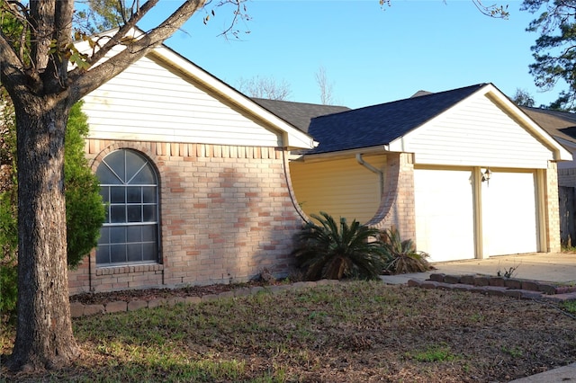 view of side of property featuring a garage