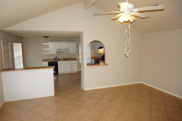 kitchen featuring sink, dishwasher, lofted ceiling with beams, white cabinets, and light tile patterned flooring